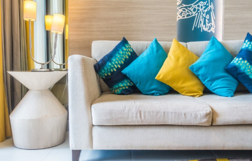 Couch with colorful throw pillows