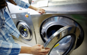 Employee monitoring clothes in industrial washer