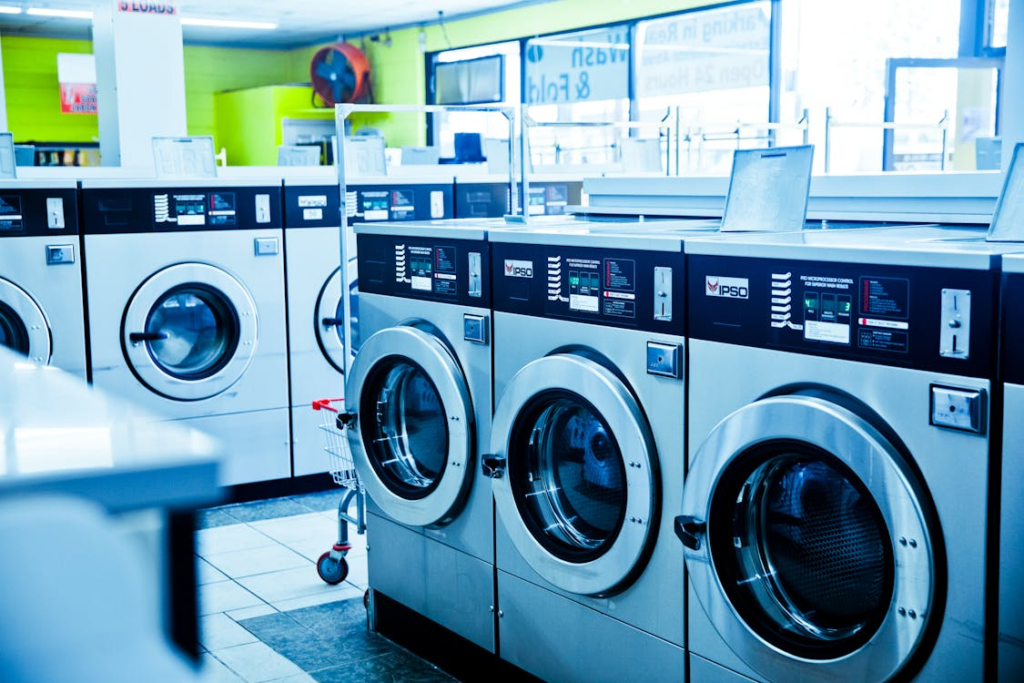 This photo shows a bunch of washing machines.