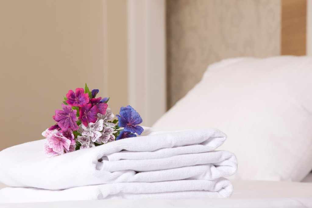 A hotel room with clean linens.