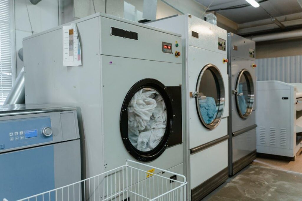 Commercial laundry machines cleaning linens