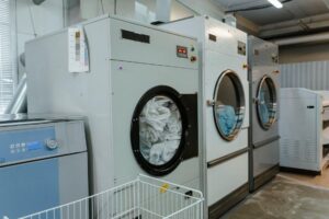 Commercial laundry machines cleaning linens