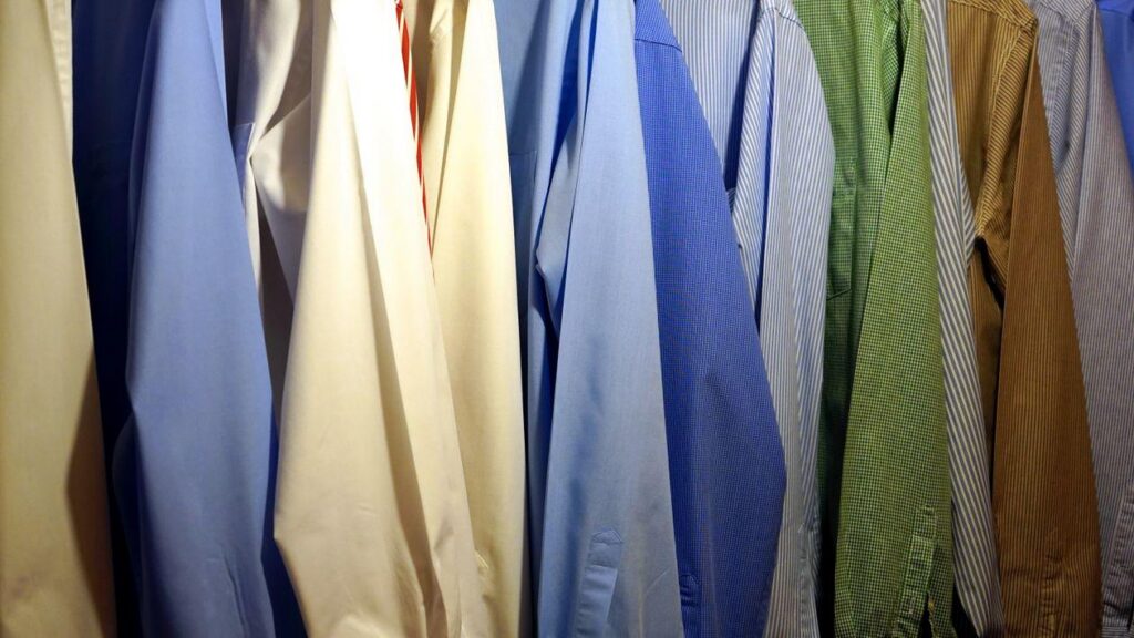 Dress shirts hanging in a closet