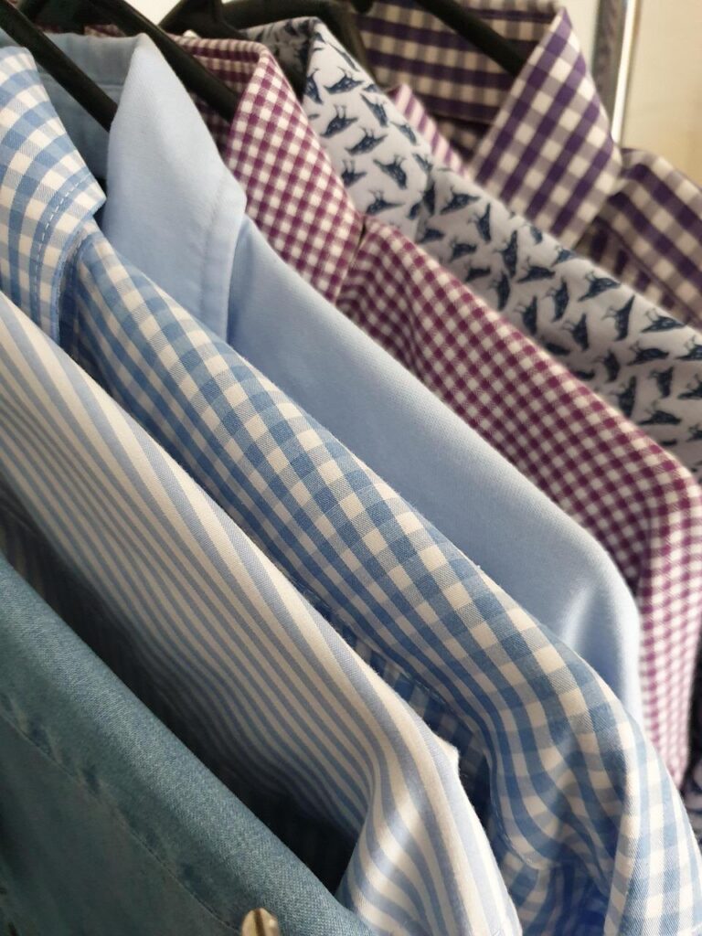 Dress shirts hanging neatly on a rack