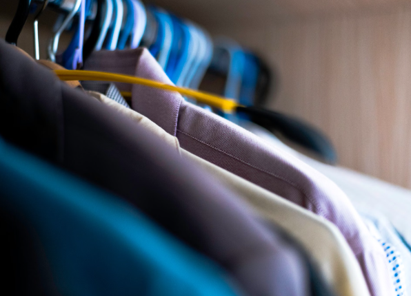 This image shows professionally cleaned shirts neatly arranged on hangers, ready for delivery