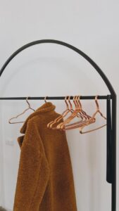 Brown coat on hanger